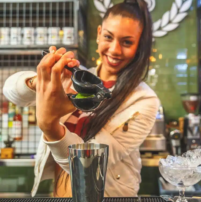 A bartender making a cocktail