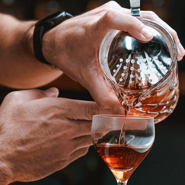 A cocktail being poured