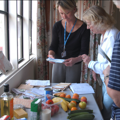 Health worker discusses food with patients