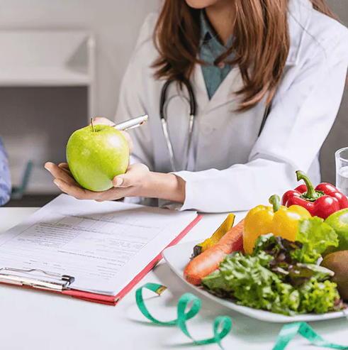 Doctor with a selection of healthy foods