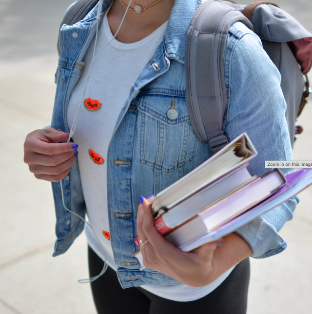 A university student carrying books